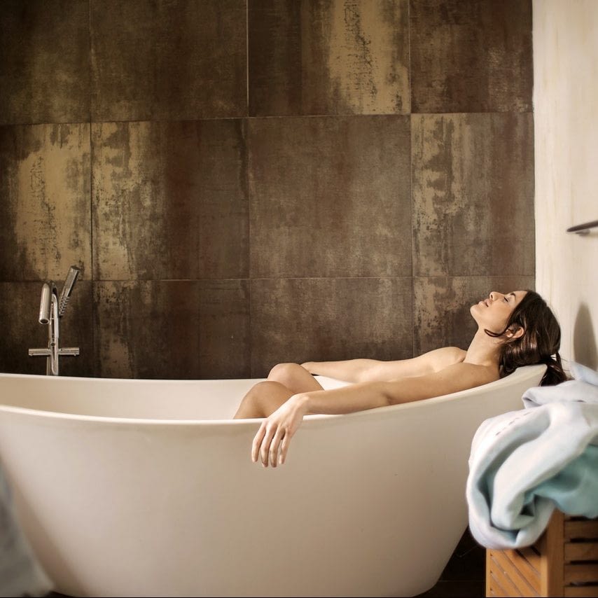 woman lying in bath woman lying in bath